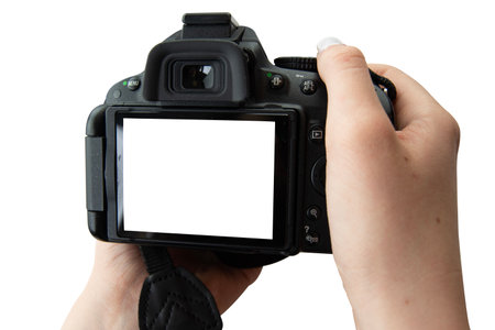 Isolated image of girls hands holding digital camera. Blank screen, copy space. Clipping path. Isolated background.の写真素材