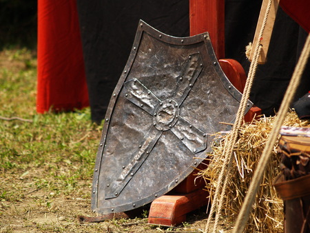 Knight shield in front of tentの写真素材