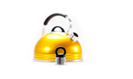 Yellow tea kettle isolated on white backgroundの写真素材