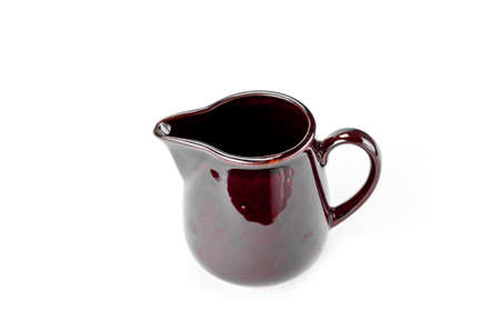 Old ceramic jug isolated on white backgroundの写真素材