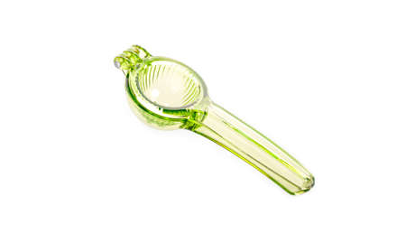 shiny plastic garlic press isolated against white background.の写真素材