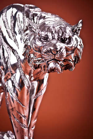Tiger Sculpture on brown backgroundの写真素材