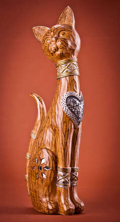 Cat  Sculpture on brown backgroundの写真素材