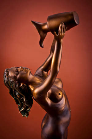 Woman Sculpture on brown backgroundの写真素材