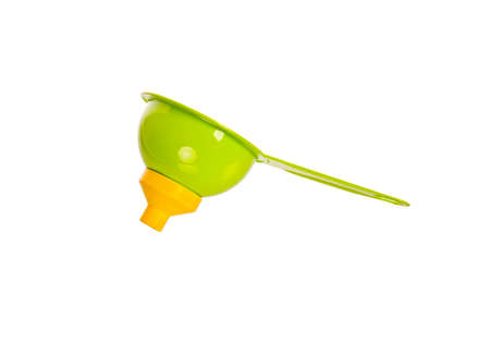Plastic kitchen funnel, isolated on a white background.の写真素材