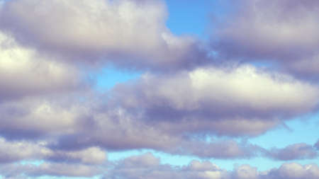 Dark clouds partially obscured the blue spring sky