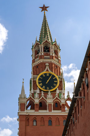 09/14/2023, Russia, Moscow, Red Square, Moscow Kremlin. The Spasskaya Tower of the Moscow Kremlin is photographed against the blue sky. View from the mausoleum of VI Lenin.のeditorial素材