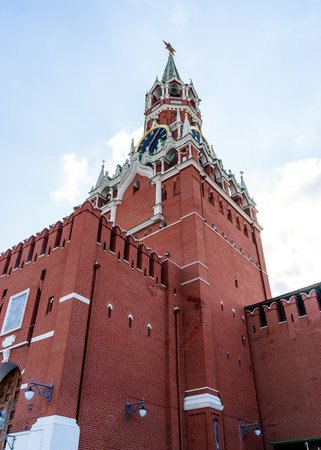 09/14/2023, Russia, Moscow, Red Square, Moscow Kremlin. The Spasskaya Tower of the Moscow Kremlin is photographed against the blue sky. View from below, from the base of the tower.のeditorial素材