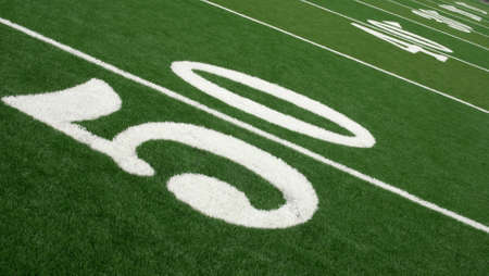 Football field showing yard markers from 50 yard line to end zone.の写真素材