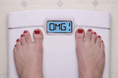 Digital Bathroom Scale Displaying OMG Messageの写真素材