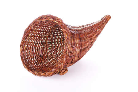 A wicker cornucopia isolated on a white backgroundの写真素材