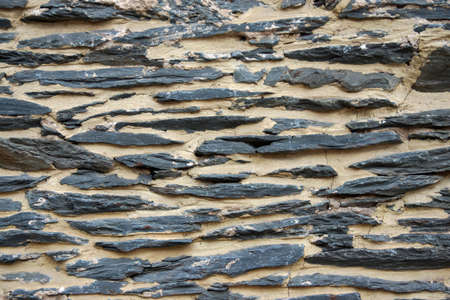 A background image of an old shale rock wall.                     