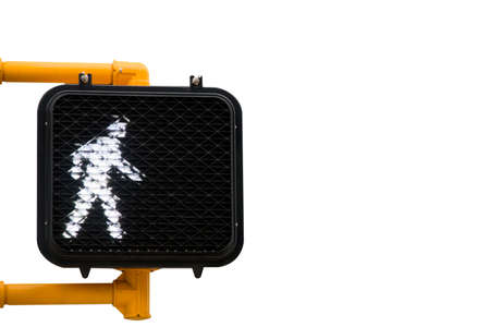 A walk sign signifying to cross the streetの写真素材