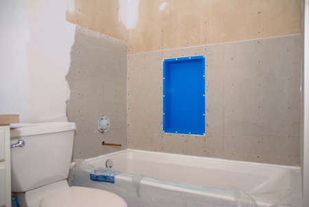 A bathroom remodeling project ready for tile to be put around the tubの写真素材