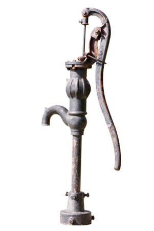 An old, iron water well pump on white backgroundの写真素材