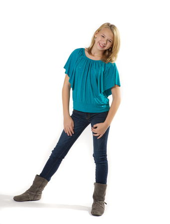 Tween girl standing and smiling.の写真素材