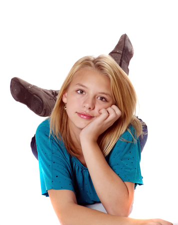 Pensive tween girl looking at camera.の写真素材