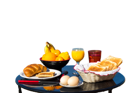 Table with food as breakfast isolated on white backgroundの写真素材