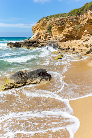 Landscape in Kefalonia Greece with mountain rocks and waves of seaの写真素材