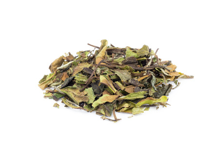 Heap of loose green leaves of white tea bai mu dan isolated on white backgroundの写真素材