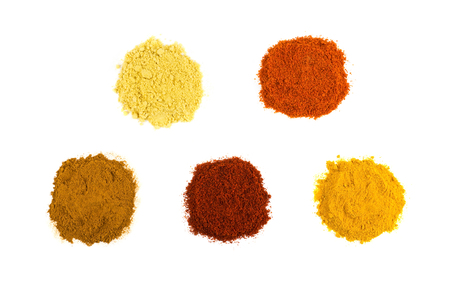 Heaps of various seasoning spices isolated on white backgroundの写真素材