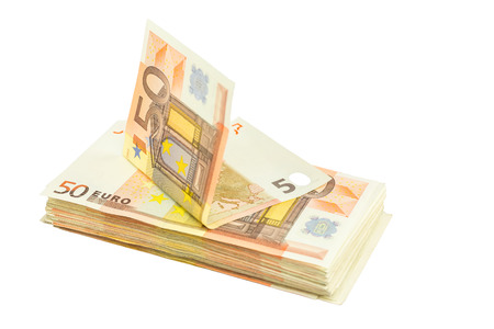 Pile of euro bills isolated on white backgroundの写真素材