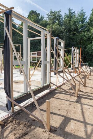 Set vertical window and door frames new house on sunny day