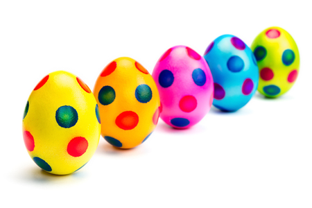 Painted easter eggs in row isolated on white backgroundの写真素材