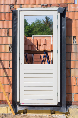 Construction site with door frame in wallの写真素材