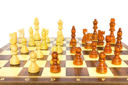 Chessboard with wooden chess pieces on white backgroundの写真素材