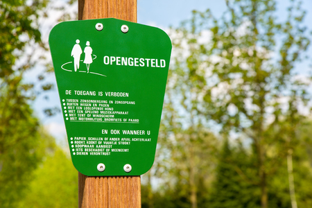 Green traffic sign for behaviour of dutch walkers in forestの写真素材