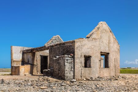 Old historic house as ruin at coast of Bonaireの写真素材