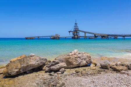 Salt Pier and rocks at sea of island Bonaire