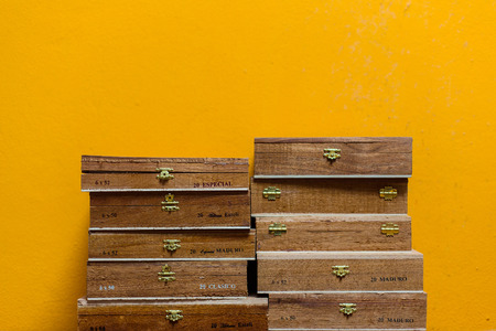Cuban Sigar Boxes on a yellow wallの写真素材