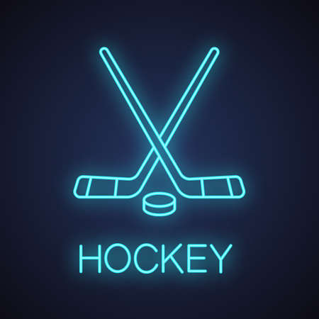 Crossed hockey sticks with puck neon light icon. Ice hockey equipment. Glowing sign. Vector isolated illustrationのイラスト素材