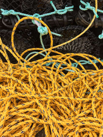 Fishing pots piled on the dockの写真素材