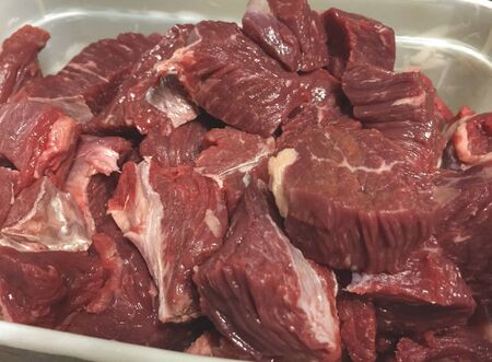 Raw beef stainless steel basin ready to be cookedの写真素材