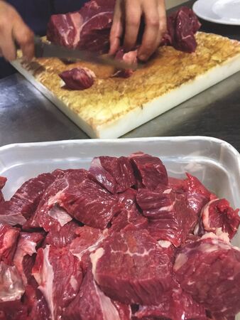 Butcher preparing beefの写真素材
