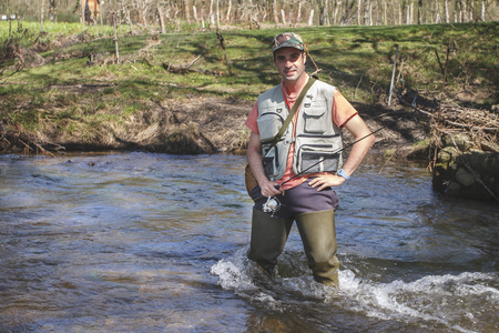 sport fisherman in river, Galicia, Spain.