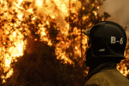 Maceda, Galicia / Spain - Oct 16 2017: Fireman in forest fire.