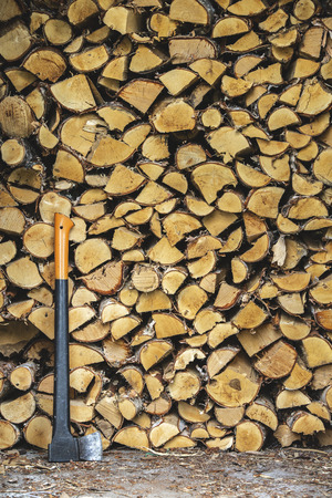 Pile of wood to burn and axeの写真素材
