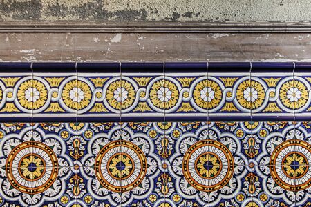 Painted tiles in old and ruined abandoned house.の写真素材