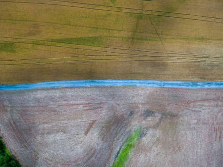 A gravel road passes through farmland near Poolesville, Montgomery County, Maryland.の写真素材