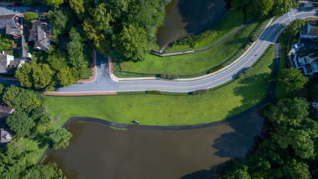 A small pond overflows it's banks after a heavy rainstorm.の写真素材