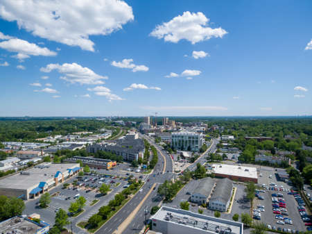Aerial View of downtown Rockville, Maryland on a sunny day looking south along Hungerford Drive (Route 355). Construction cranes at Rockville Town Center touch the horizon.のeditorial素材