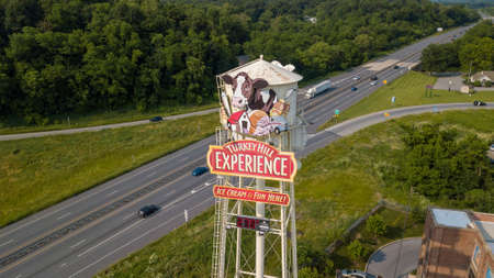 Columbia, Pa. - June 1, 2019: A water tower, adorned by a billboard for the Turkey Hill Experience tour, stands over US Route 30 in Lancaster County, Pennsylvania.のeditorial素材