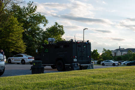 Rockville, Md. - July 1, 2020: A Montgomery County, Maryland police Emergency Services (SWAT) armored vehicle stages near a barricade with an armed individual. The individual was safely apprehended.のeditorial素材