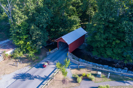 A motorcycle approaches a covered bridge in Frederick County, Maryland