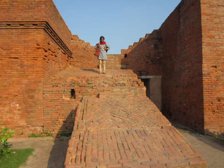 Aboriginal Indian lady stand in Ruins of Nalanda University, Nalanda, Indiaのeditorial素材