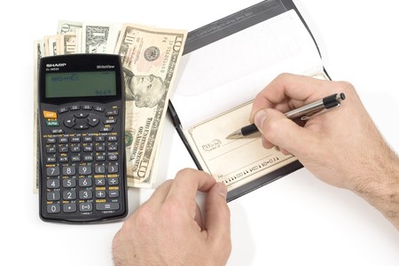 A person writting a checkの写真素材